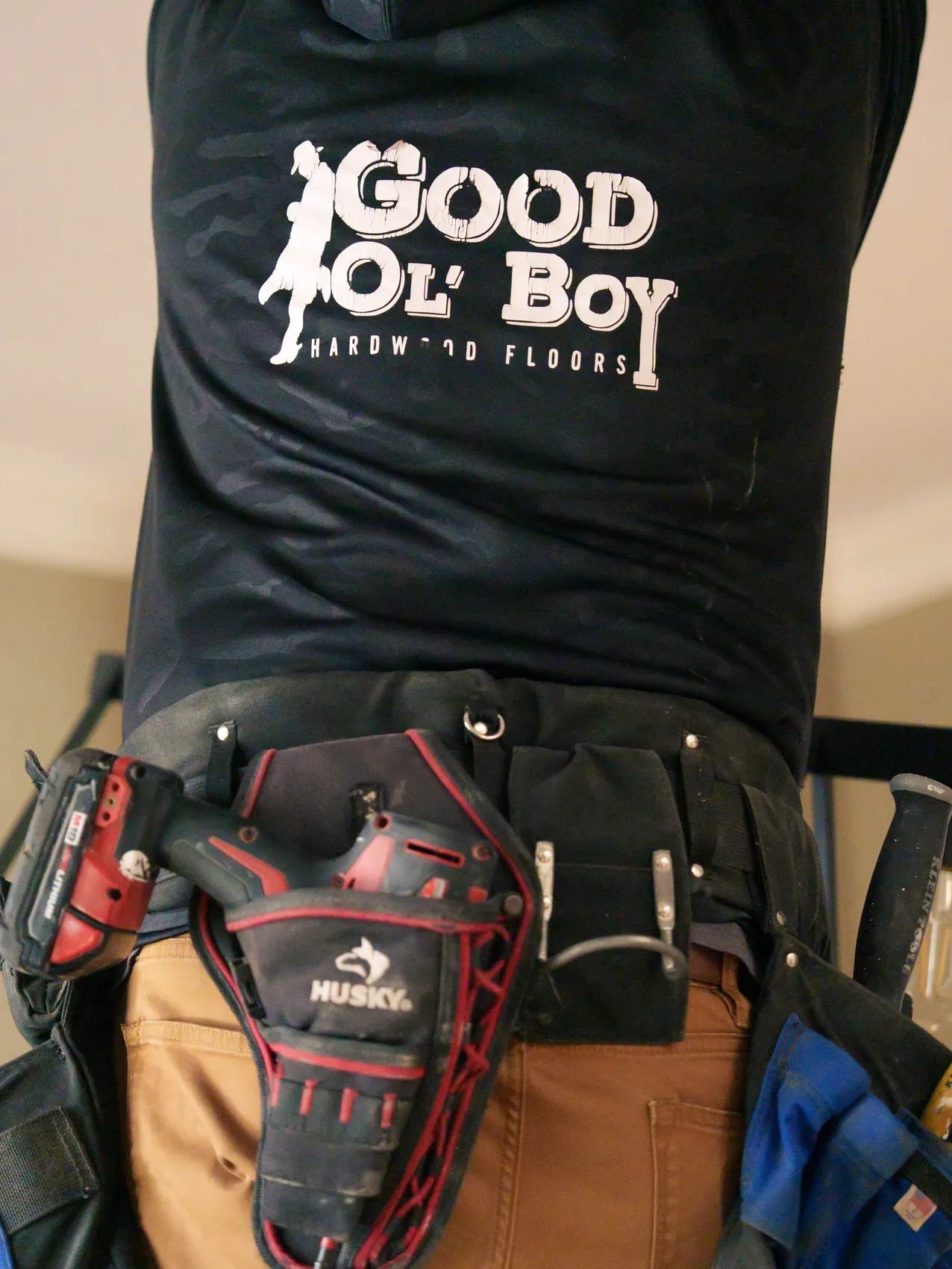 Hardwood flooring craftsman tool belt on a job site